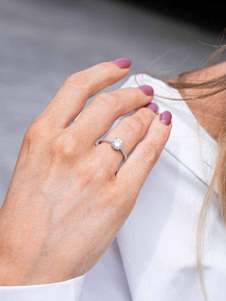 1.1CTW Moissanite Signature Side Stone Round Engagement Ring