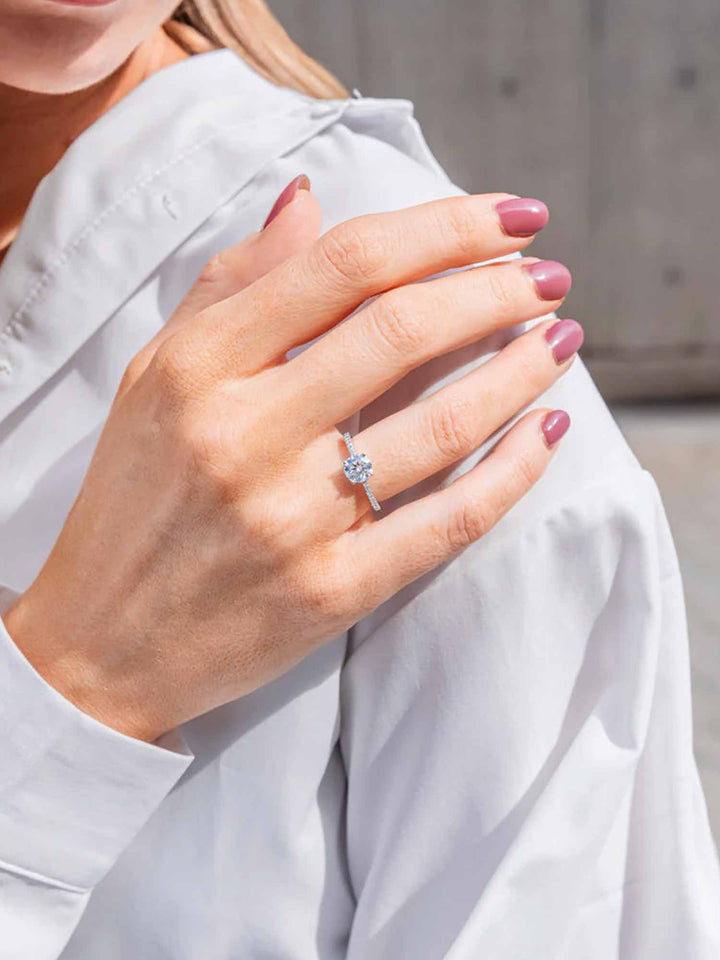 1.1CTW Moissanite Signature Side Stone Round Engagement Ring