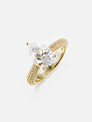 Pear Cut Halo Ring With Side Diamonds